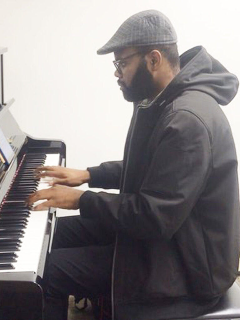 Innocent Okechukwu - Composer - on the piano