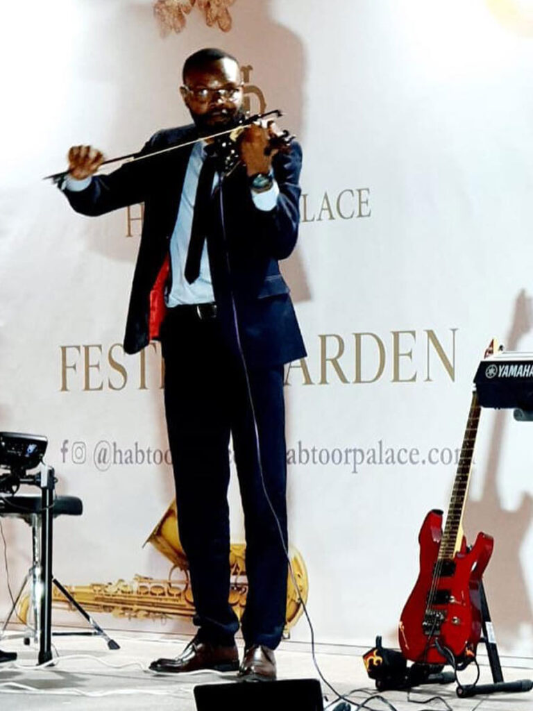 Innocent Okechukwu playing violin