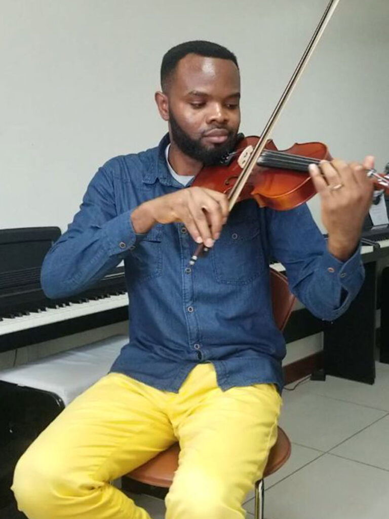 Innocent Okechukwu - Composer -Playing the violin
